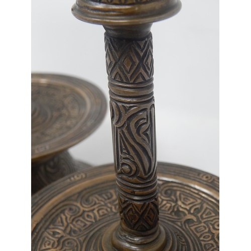 142 - Pair of Islamic/Middle Eastern Bronze Candlesticks with engraved decoration. Each Measuring 20.5cm h... 