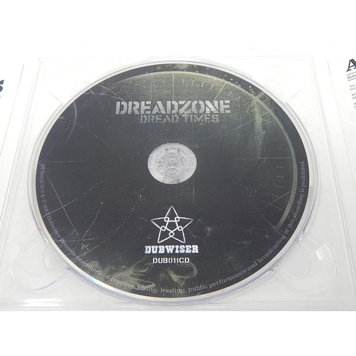 147 - Dreadzone: Dread Times 2012: Signed to front cover by ALL Band Members.