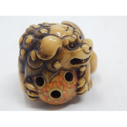 153 - Japanese Signed Netsuke of a Shishi, Foo Dog resting on the ball of life: Edo/Meiji Period: Measures... 