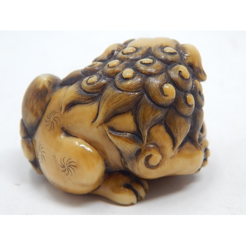 153 - Japanese Signed Netsuke of a Shishi, Foo Dog resting on the ball of life: Edo/Meiji Period: Measures... 