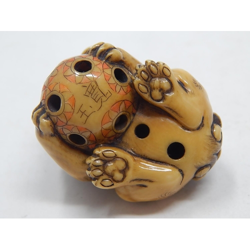 153 - Japanese Signed Netsuke of a Shishi, Foo Dog resting on the ball of life: Edo/Meiji Period: Measures... 