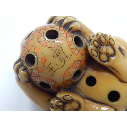 153 - Japanese Signed Netsuke of a Shishi, Foo Dog resting on the ball of life: Edo/Meiji Period: Measures... 