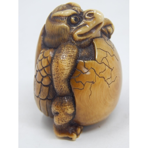 155 - Japanese Signed Netsuke of a Tengu breaking out of shell: Edo/Meiji Period: Measures 4.5cm high.