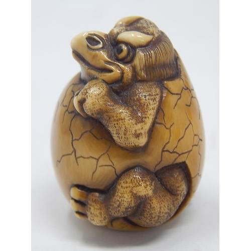 155 - Japanese Signed Netsuke of a Tengu breaking out of shell: Edo/Meiji Period: Measures 4.5cm high.