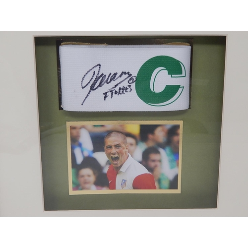 171 - FERNANDO TORRES: Atletico Madrid June 2005 Signed Captains Armband with Photograph: Measures 35cm x ... 