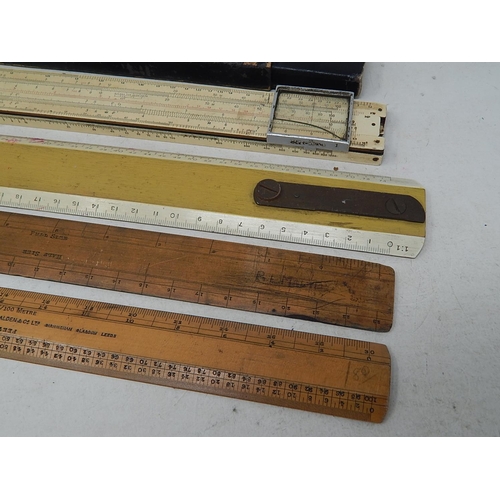 177 - Group of Rulers to Include a slide rule by Faber & Castell.