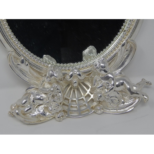 404 - Silver Plated Bronze Wall Mirror of Oval Form Surmounted with Cast Bronze Cherubs: Measures 38cm x 2... 