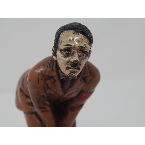 512 - WWII: A novelty Adolf Hitler cold painted bronze figural pin cushion, realistically modelled bent-ov... 