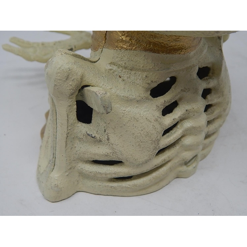 481 - Cast Iron Novelty Money Box Modelled as a Skeleton. The Rear Lever When Pushed Lifts The Skeleton's ... 