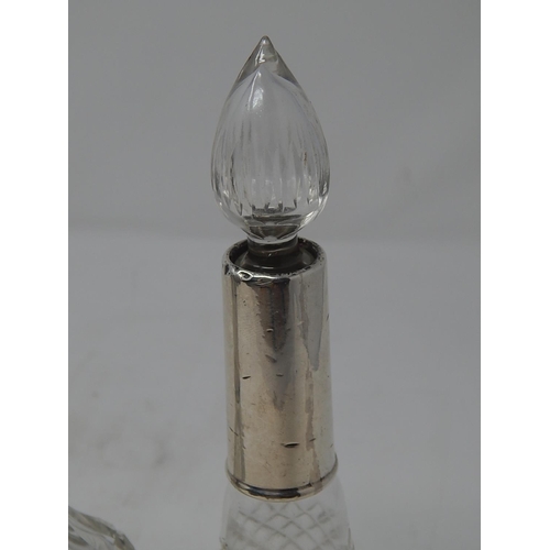 35 - Two Silver Mounted Glass Scent Bottles with Stoppers: Measuring 19.5cm / 17cm.