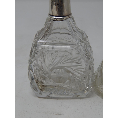 35 - Two Silver Mounted Glass Scent Bottles with Stoppers: Measuring 19.5cm / 17cm.