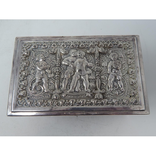 39 - Heavy Silver Plated Box Depicting Putti & Cherubs: Measuring 16cm x 10cm x 6.5cm.