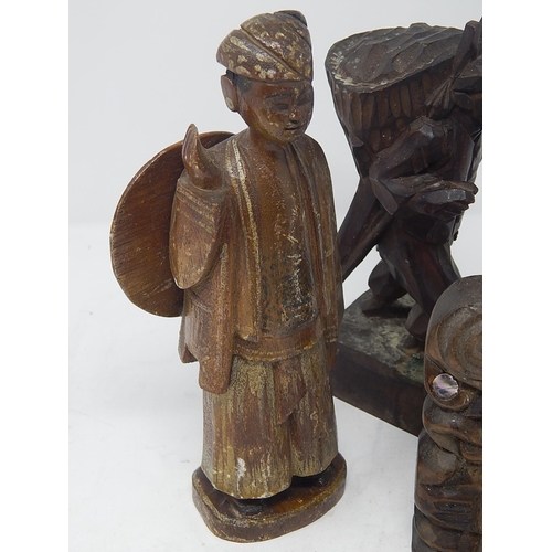 491 - Four Hand Carved Wooden Figures: The Tallest Measuring 21cm.