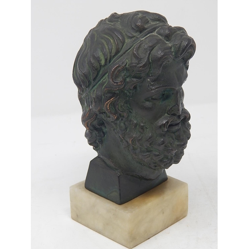 497 - Antique Bronze Head of a God on Alabaster Base: Measures 16.5cm High.