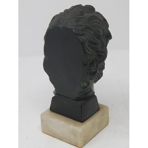 497 - Antique Bronze Head of a God on Alabaster Base: Measures 16.5cm High.