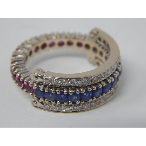 47 - 18ct White Gold Ring Stamped 750 with a central band of 14 Burmese Sapphires (approx 1ct) flanked by... 