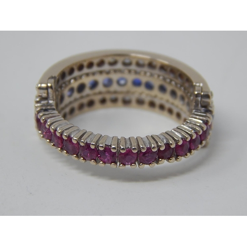 47 - 18ct White Gold Ring Stamped 750 with a central band of 14 Burmese Sapphires (approx 1ct) flanked by... 