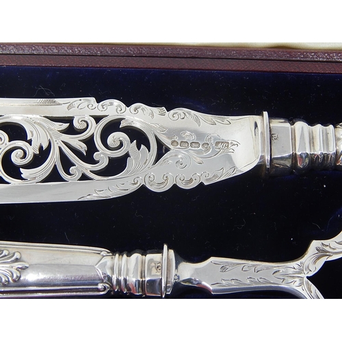 48 - Victorian Silver Fish Servers, comprising pierced knife (32cm) with matching fork (24cm) Hallmarked ... 