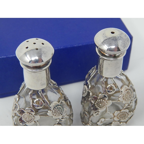 50 - Japanese Silver Mounted Cruet Set comprising salt & pepper, overlaid with silver prunus decoration. ... 