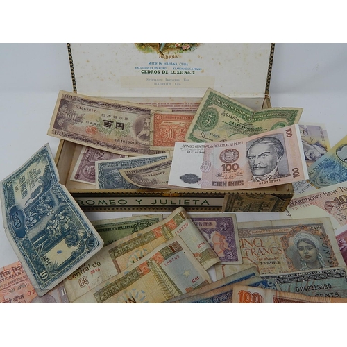 17 - A cigar box full of GB and World Banknotes