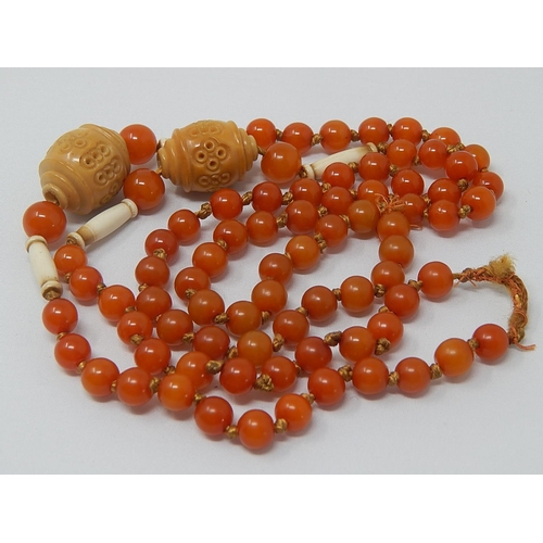 136 - 1920's Amber Necklace with Ivory & Stained Ivory Spacers: Length 90cm: Gross Weight 37g