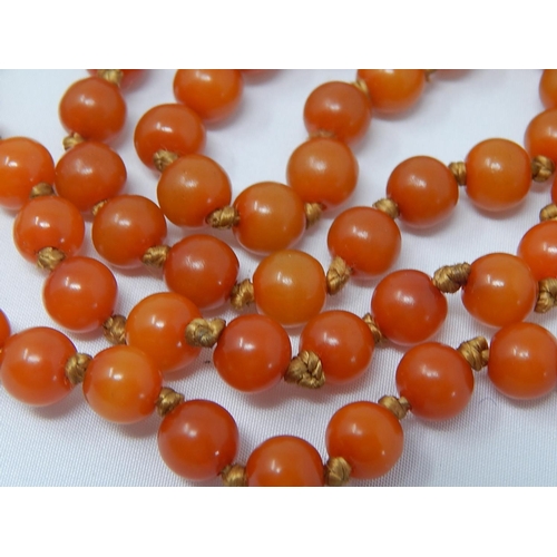 136 - 1920's Amber Necklace with Ivory & Stained Ivory Spacers: Length 90cm: Gross Weight 37g