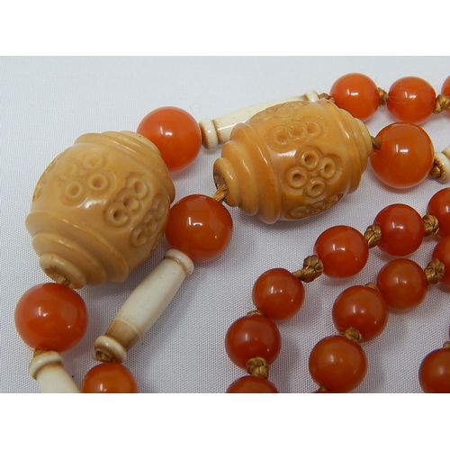 136 - 1920's Amber Necklace with Ivory & Stained Ivory Spacers: Length 90cm: Gross Weight 37g