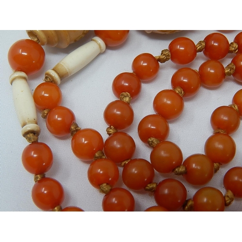 136 - 1920's Amber Necklace with Ivory & Stained Ivory Spacers: Length 90cm: Gross Weight 37g