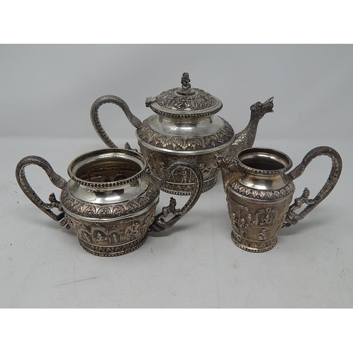 153 - C19th Colonial Indian Silver Three Piece Tea Set: Possibly by OOMERSI MAWJI, BHUJ, Comprising Teapot... 