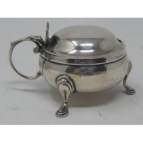 172 - Silver Mustard Pot with hinged lid & blue glass liner: Hallmarked London 1958 by C.E: Measures 6cm d... 