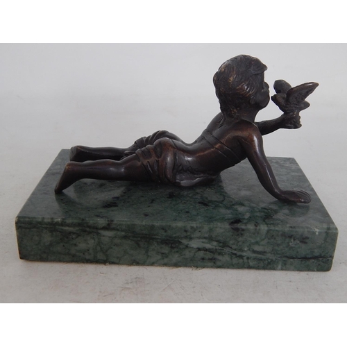 487 - A Cast Bronze Sculpture of a Cherub Holding a Bird on Marble Plinth: Measures 13cm wide overall