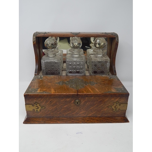 549 - Victorian Oak Tantalus Compendium with Brass Fittings Containing Its Three Original Fitted Cut Glass... 