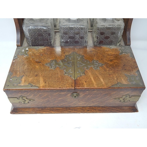 549 - Victorian Oak Tantalus Compendium with Brass Fittings Containing Its Three Original Fitted Cut Glass... 