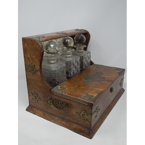 549 - Victorian Oak Tantalus Compendium with Brass Fittings Containing Its Three Original Fitted Cut Glass... 