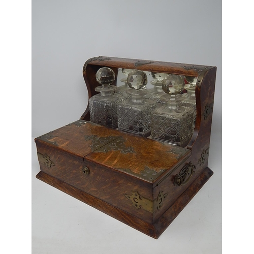 549 - Victorian Oak Tantalus Compendium with Brass Fittings Containing Its Three Original Fitted Cut Glass... 