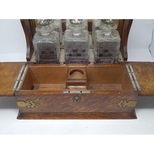 549 - Victorian Oak Tantalus Compendium with Brass Fittings Containing Its Three Original Fitted Cut Glass... 