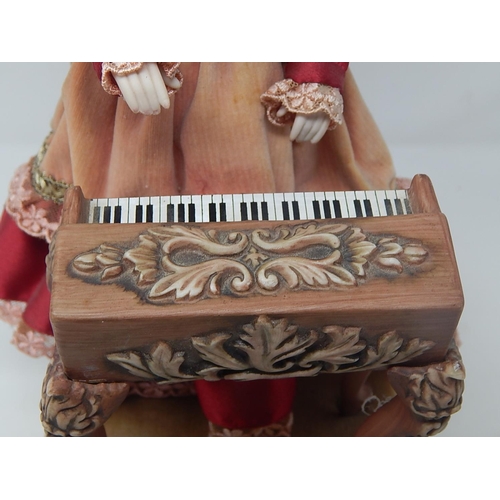 551 - Vintage Automaton Musical Doll Playing The Piano. Note: The Ceramic Piano needs one leg reattaching.... 