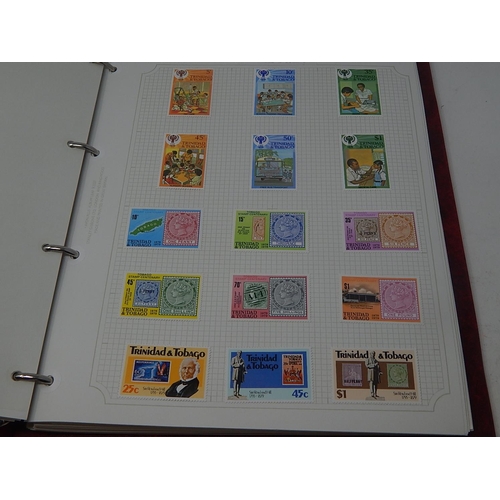 72 - Trinidad and Tobago, Tristan da Cunha inc mini sheets housed in maroon Stanley Gibbons Avon album