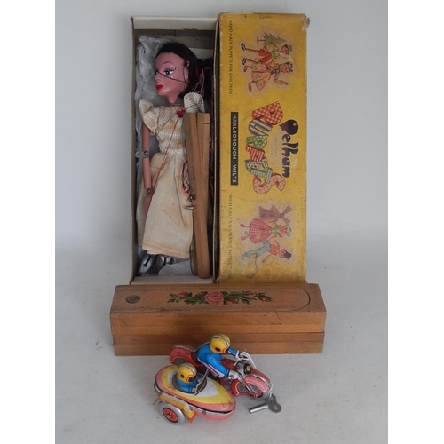 598 - Pelham Puppet in original box together with a tin plate clockwork motorcycle & sidecar with key: Woo... 