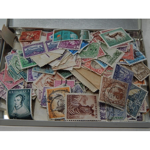 179 - Two tins containing China and South Africa stamps; selection of GB stamps on various album pages