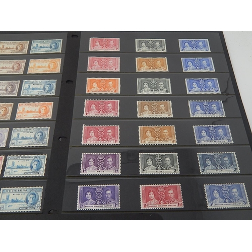 108 - A large selection of 1937 Coronation stamps and 1946 Victory Stamps all Mint housed on 5 Hagner shee... 