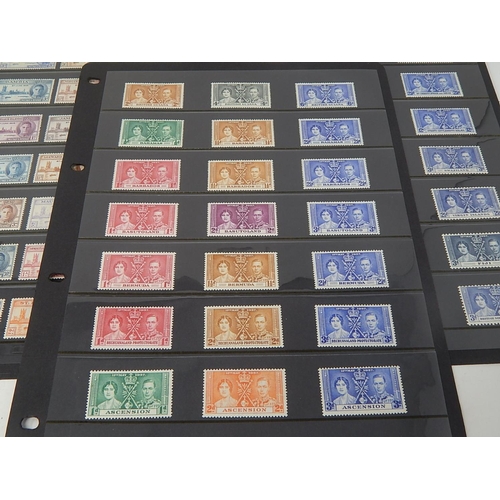 108 - A large selection of 1937 Coronation stamps and 1946 Victory Stamps all Mint housed on 5 Hagner shee... 