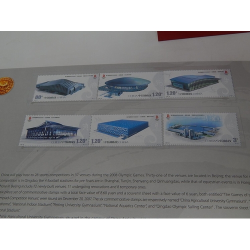 96 - Rare One World One Dream Collection of stamps from the Games of the XXIX Olympiad in red folder of i... 