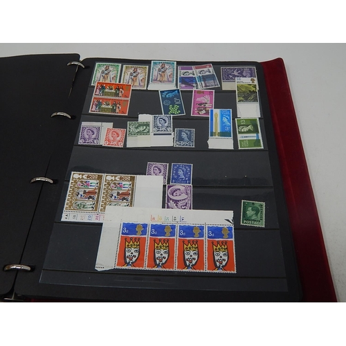 121 - A superb collection of Mint Pre-Decimal Stamps including George VI in blocks, etc housed in maroon c... 