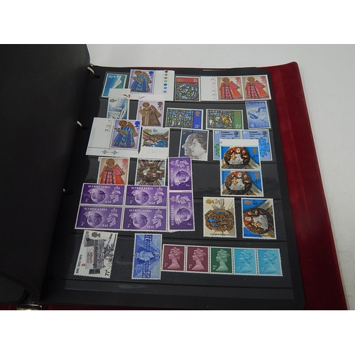 121 - A superb collection of Mint Pre-Decimal Stamps including George VI in blocks, etc housed in maroon c... 