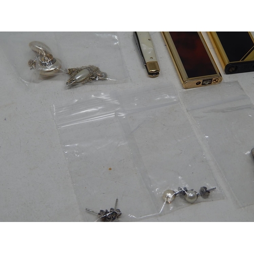 40 - A large collection of costume jewellery, earrings etc, some rings, some in precious metal, etc