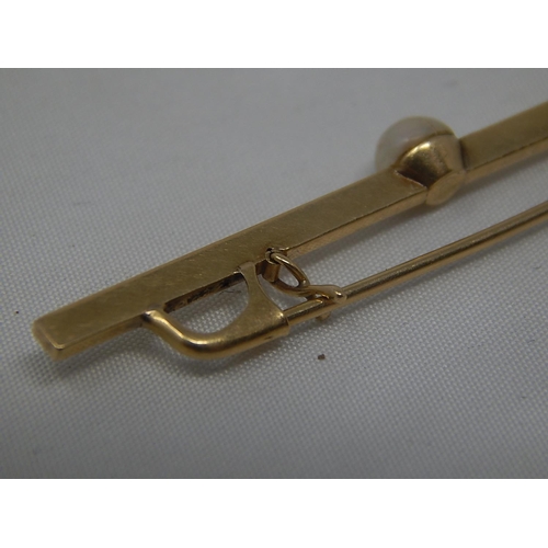 269 - 14ct (585) Gold Bar Brooch Set With a Natural Pearl. Length 5cm.