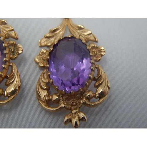 271 - Pair of Large Amethyst Set Earrings in Hallmarked 9ct Gold: 3.6cm Drop.