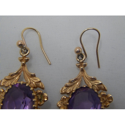 271 - Pair of Large Amethyst Set Earrings in Hallmarked 9ct Gold: 3.6cm Drop.