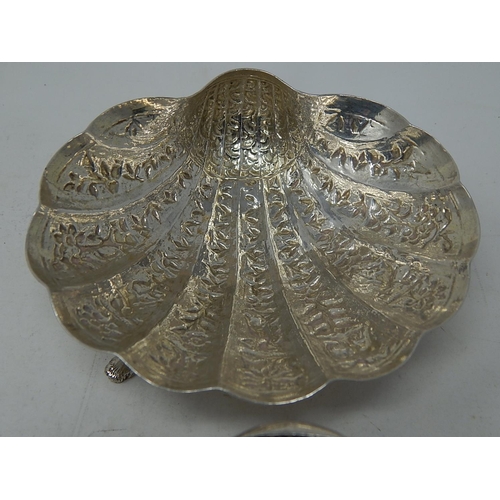 313 - A Pair of Indian Silver (Unmarked but testing as fine silver) Shell Form Dishes decorated with Anima... 